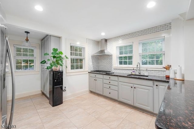 328 John St, Bound Brook Boro, NJ 08805 - kitchen with wall chimney exhaust hood, healthy amount of natural light, tasteful backsplash, stainless steel appliances, and recessed lighting