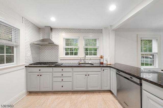 328 John St, Bound Brook Boro, NJ 08805 - kitchen with wall chimney exhaust hood, appliances with stainless steel finishes, plenty of natural light, tasteful backsplash, and recessed lighting