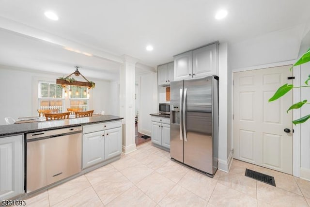 328 John St, Bound Brook Boro, NJ 08805 - kitchen with stainless steel appliances, recessed lighting, light tile patterned floors, and decorative columns