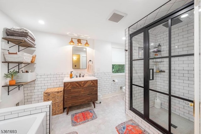 328 John St, Bound Brook Boro, NJ 08805 - full bath with tile walls, vanity, a stall shower, a bath, and recessed lighting