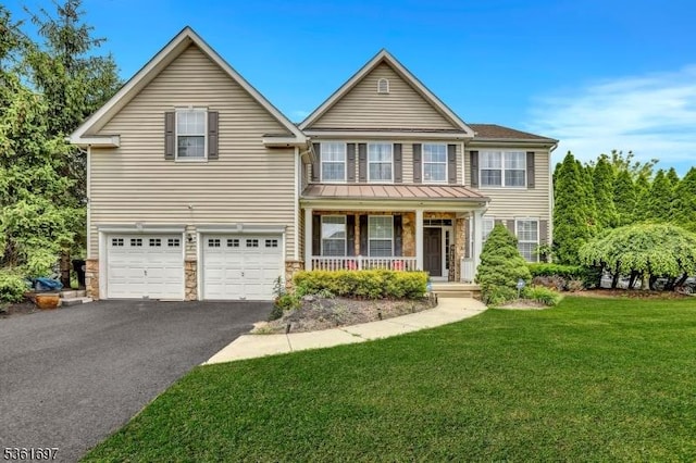 7 Westbury Dr, Winslow Twp, NJ 08009 - traditional-style house with covered porch, asphalt driveway, a front yard, stone siding, and an attached garage