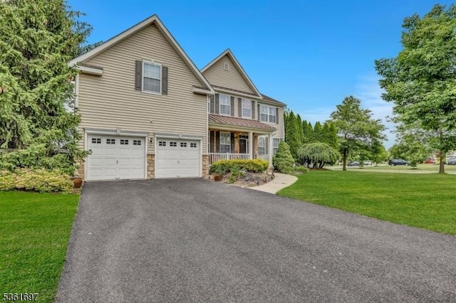 7 Westbury Dr, Winslow Twp, NJ 08009 - traditional-style house with a front yard, driveway, an attached garage, stone siding, and covered porch