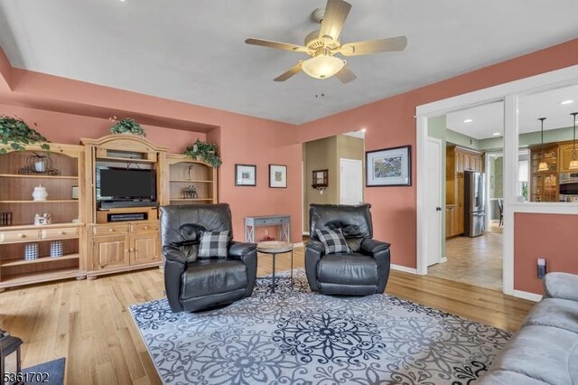 11 Wesley Rd, Hillsborough Twp, NJ 08844 - living area featuring light wood-style flooring, a ceiling fan, and baseboards