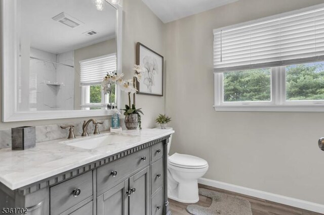11 Wesley Rd, Hillsborough Twp, NJ 08844 - full bathroom featuring vanity, toilet, healthy amount of natural light, and wood finished floors