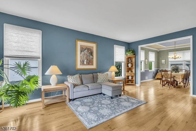 11 Wesley Rd, Hillsborough Twp, NJ 08844 - living area featuring a chandelier, baseboards, and wood finished floors