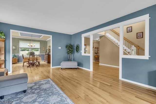 11 Wesley Rd, Hillsborough Twp, NJ 08844 - living area featuring wood finished floors, a chandelier, and baseboards