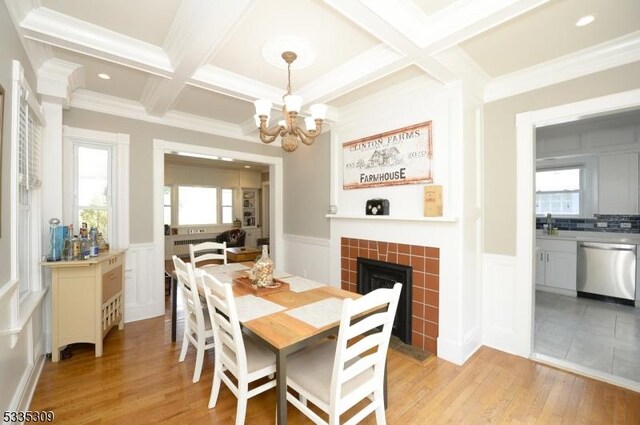 7 Clinton St, Morristown Town, NJ 07960 - dining room with coffered ceiling, a decorative wall, light wood-type flooring, a chandelier, and a fireplace