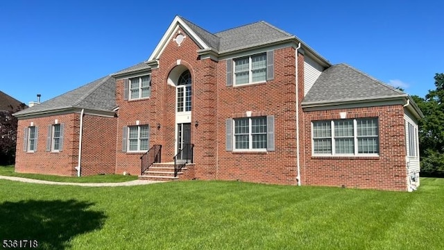2 Murphy Dr, Hillsborough Twp, NJ 08844 - view of front of property featuring brick siding, a front lawn, and roof with shingles