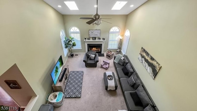 2 Murphy Dr, Hillsborough Twp, NJ 08844 - carpeted living area featuring high vaulted ceiling, a lit fireplace, a ceiling fan, and recessed lighting