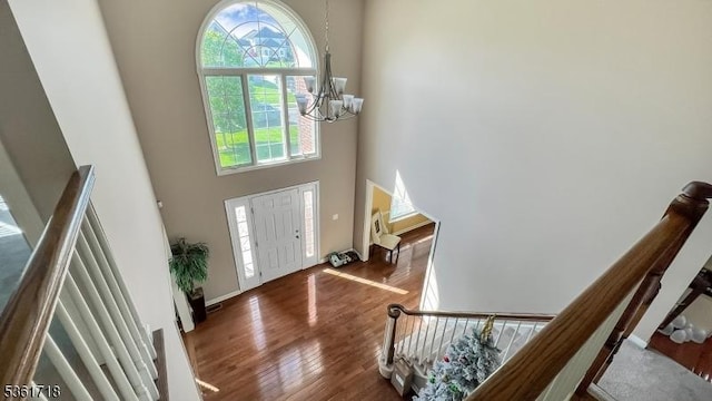 2 Murphy Dr, Hillsborough Twp, NJ 08844 - entryway featuring a chandelier, plenty of natural light, a towering ceiling, wood finished floors, and stairway