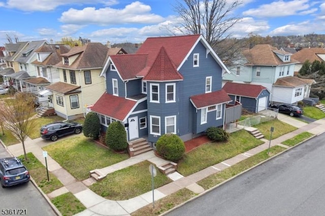 234 Trenton Ave, Clifton City, NJ 07011 - victorian home featuring a residential view, a garage, entry steps, and a front yard