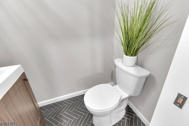 234 Trenton Ave, Clifton City, NJ 07011 - half bathroom featuring toilet, vanity, and baseboards