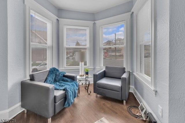 234 Trenton Ave, Clifton City, NJ 07011 - living area with a textured wall, wood finished floors, and baseboards