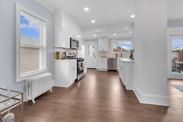 234 Trenton Ave, Clifton City, NJ 07011 - kitchen featuring stainless steel appliances, radiator heating unit, dark wood finished floors, white cabinetry, and recessed lighting