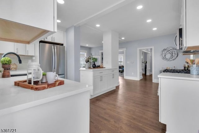 234 Trenton Ave, Clifton City, NJ 07011 - kitchen featuring stainless steel appliances, white cabinets, dark wood-style floors, a sink, and light countertops