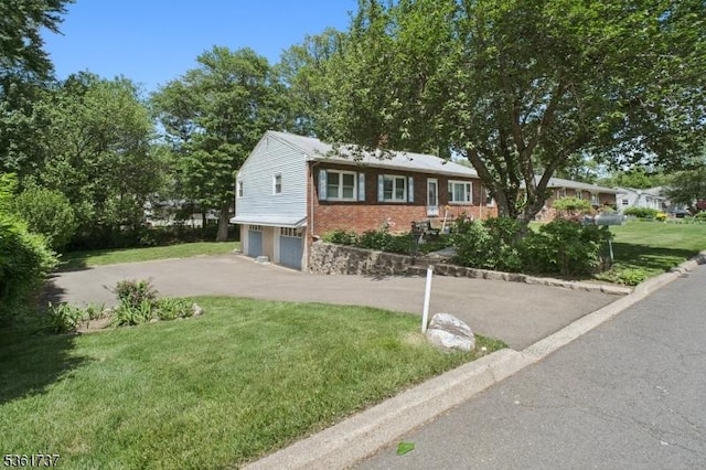 28 Stylon Rd, Wayne Twp, NJ 07470 - ranch-style house with a garage, driveway, brick siding, and a front yard