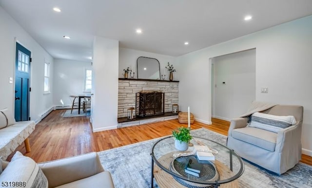 1473 Sussex Tpke, Randolph Twp, NJ 07869 - living area featuring a fireplace, wood finished floors, recessed lighting, baseboards, and baseboard heating
