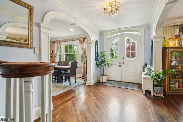 27 Fairway Dr, West Orange Twp, NJ 07052 - entryway featuring arched walkways, ornamental molding, wood finished floors, french doors, and baseboards