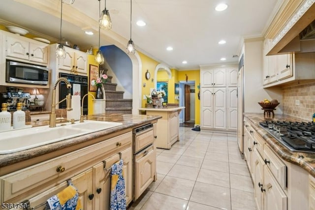 27 Fairway Dr, West Orange Twp, NJ 07052 - kitchen featuring appliances with stainless steel finishes, a sink, wall chimney exhaust hood, ornamental molding, and tasteful backsplash