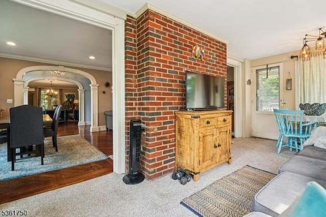 27 Fairway Dr, West Orange Twp, NJ 07052 - carpeted living room featuring decorative columns, arched walkways, plenty of natural light, and ornamental molding