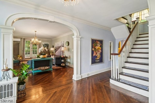 27 Fairway Dr, West Orange Twp, NJ 07052 - foyer entrance featuring a chandelier, wood finished floors, stairs, arched walkways, and crown molding