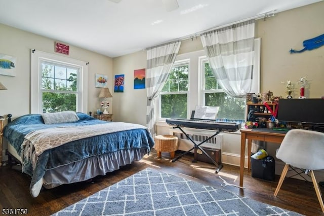 27 Fairway Dr, West Orange Twp, NJ 07052 - bedroom featuring radiator heating unit and wood finished floors