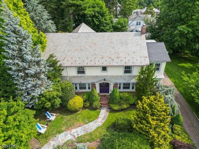 27 Fairway Dr, West Orange Twp, NJ 07052 - view of front of property featuring a chimney, a high end roof, a front lawn, and stone siding