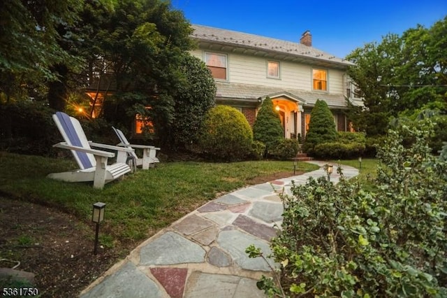 27 Fairway Dr, West Orange Twp, NJ 07052 - view of front of property featuring a chimney, a front lawn, and brick siding