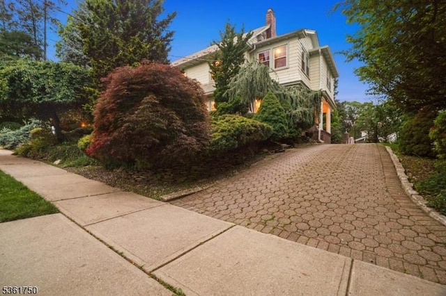 27 Fairway Dr, West Orange Twp, NJ 07052 - view of side of property with driveway and a chimney