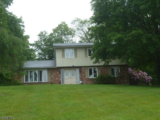 3 Bingham Ln, Blairstown Twp, NJ 07825 - view of front of house with a front yard, brick siding, and french doors
