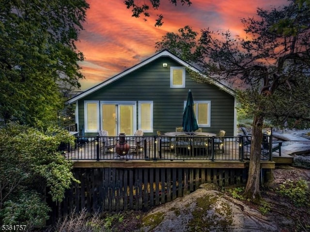 172 Alpine Trl, Sparta Twp, NJ 07871 - back of house at dusk with a deck