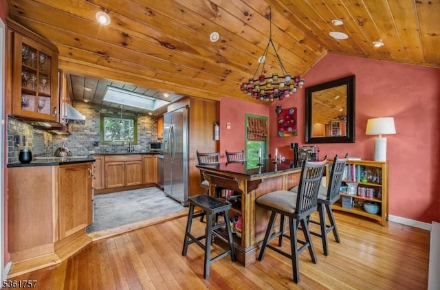 172 Alpine Trl, Sparta Twp, NJ 07871 - dining space with light wood-type flooring, wooden ceiling, vaulted ceiling, and baseboards
