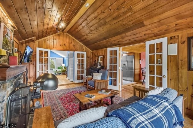 172 Alpine Trl, Sparta Twp, NJ 07871 - living room featuring french doors, wood walls, wood finished floors, vaulted ceiling, and wood ceiling