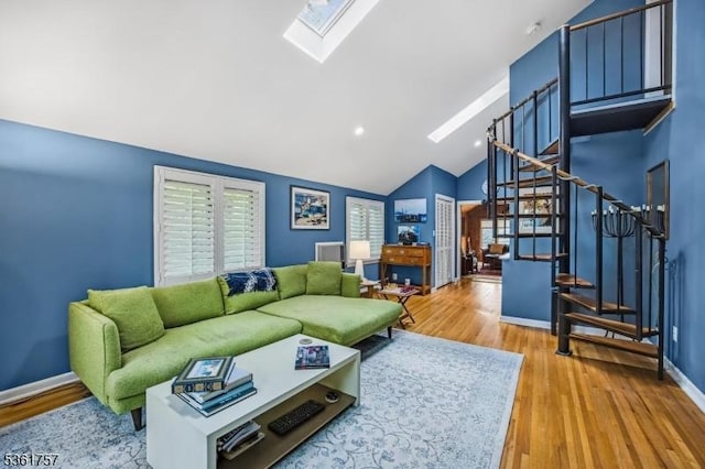 172 Alpine Trl, Sparta Twp, NJ 07871 - living area with a skylight, stairway, vaulted ceiling, wood finished floors, and baseboards