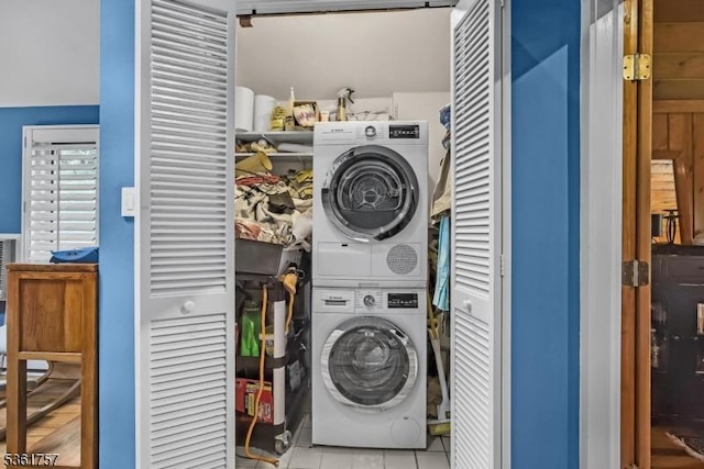 172 Alpine Trl, Sparta Twp, NJ 07871 - laundry area with stacked washer and clothes dryer and tile patterned floors