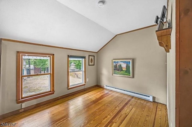 172 Alpine Trl, Sparta Twp, NJ 07871 - spare room featuring a baseboard radiator, vaulted ceiling, light wood finished floors, and ornamental molding