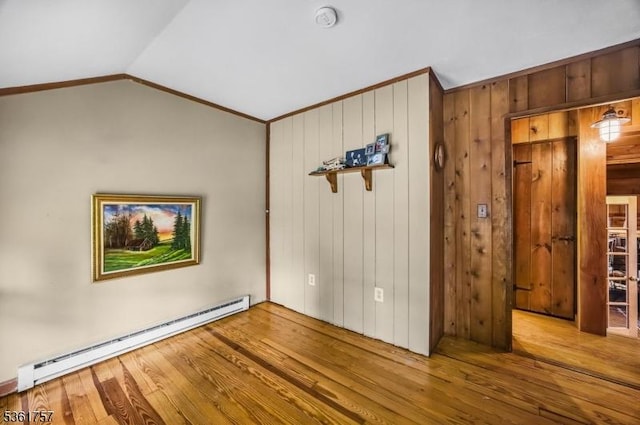 172 Alpine Trl, Sparta Twp, NJ 07871 - unfurnished bedroom with baseboard heating, wood finished floors, crown molding, lofted ceiling, and wood walls