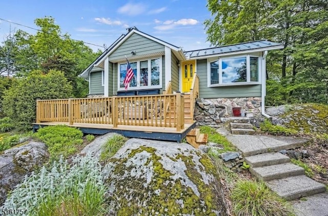 172 Alpine Trl, Sparta Twp, NJ 07871 - view of front facade featuring a standing seam roof, metal roof, a wooden deck, and stone siding