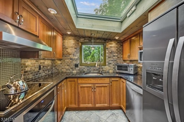 172 Alpine Trl, Sparta Twp, NJ 07871 - kitchen featuring appliances with stainless steel finishes, under cabinet range hood, a sink, and brown cabinetry