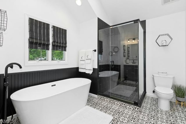 11 Putnam Ave, Berkeley Heights Twp, NJ 07922 - full bath featuring a soaking tub, toilet, a stall shower, vaulted ceiling, and tile patterned flooring