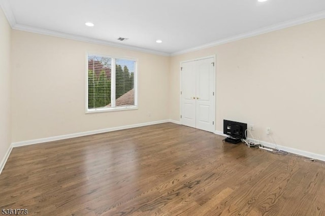 11 Putnam Ave, Berkeley Heights Twp, NJ 07922 - spare room featuring a wood stove, wood finished floors, baseboards, ornamental molding, and recessed lighting