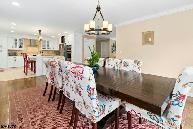 11 Putnam Ave, Berkeley Heights Twp, NJ 07922 - dining space with a chandelier, recessed lighting, light wood-style flooring, and ornamental molding