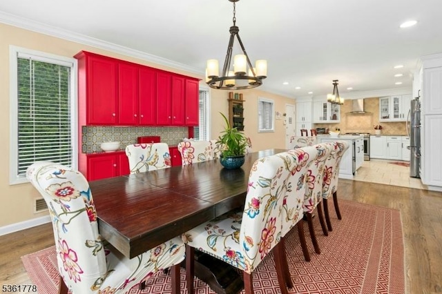11 Putnam Ave, Berkeley Heights Twp, NJ 07922 - dining room featuring a chandelier, wood finished floors, recessed lighting, crown molding, and baseboards