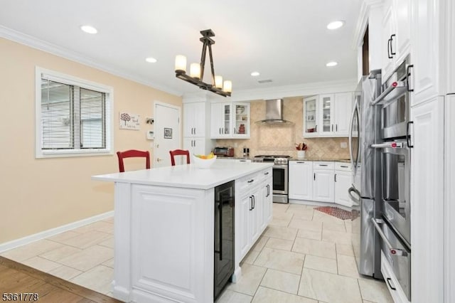 11 Putnam Ave, Berkeley Heights Twp, NJ 07922 - kitchen with appliances with stainless steel finishes, beverage cooler, backsplash, a center island, and light countertops