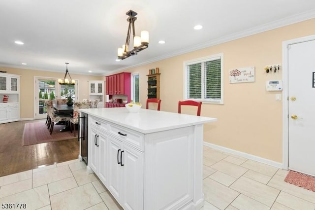 11 Putnam Ave, Berkeley Heights Twp, NJ 07922 - kitchen featuring a chandelier, crown molding, white cabinets, light countertops, and decorative light fixtures