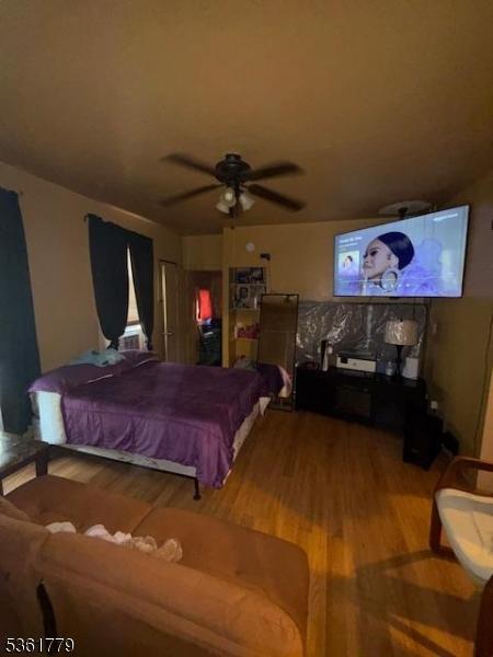 286 N 6th St, Prospect Park Boro, NJ 07508 - bedroom featuring wood finished floors and ceiling fan
