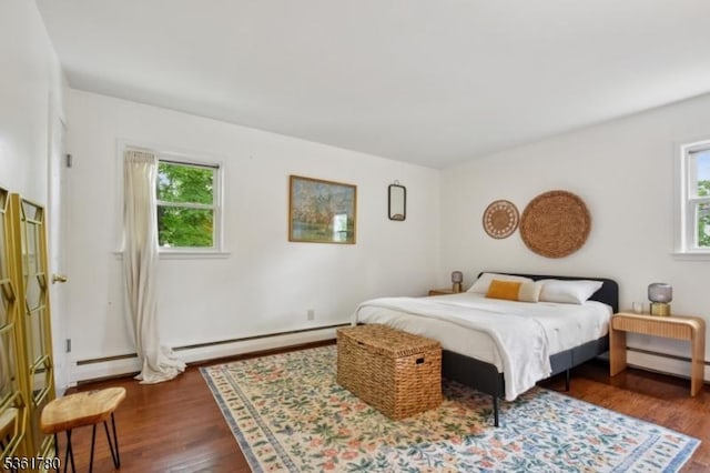 121 3rd St, South Orange Village Twp, NJ 07079 - bedroom with multiple windows, wood finished floors, and a baseboard heating unit