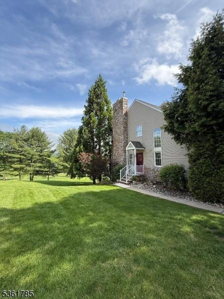 20 Pinehurst Dr, Washington Twp, NJ 07882 - view of front of property with a front lawn and a chimney