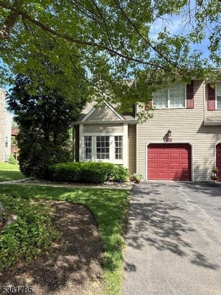 20 Pinehurst Dr, Washington Twp, NJ 07882 - view of front of property with asphalt driveway and an attached garage