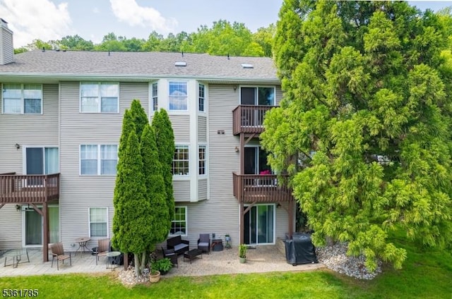 20 Pinehurst Dr, Washington Twp, NJ 07882 - rear view of house featuring a patio, a chimney, and a lawn